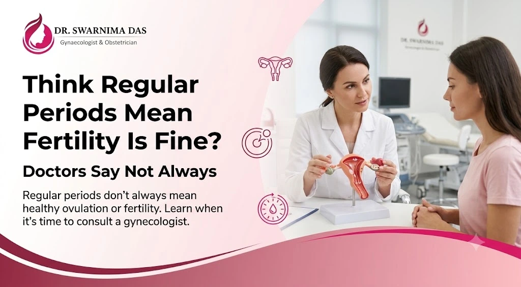 Woman discussing fertility concerns with a gynecologist despite having regular menstrual cycles